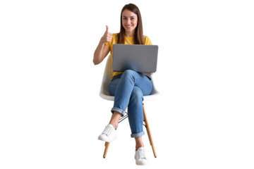 smiling woman in casual jeans and a yellow shirt, seated on a modern chair with a laptop