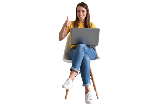 smiling woman in casual jeans and a yellow shirt, seated on a modern chair with a laptop