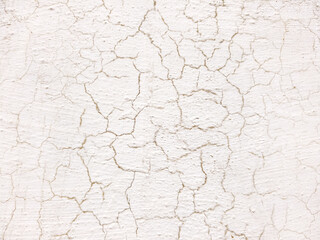 Old cracked paint on white wall. Abstract background and texture for design.