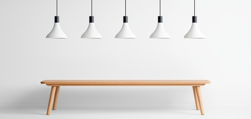 A modern dining space featuring a wooden table and four minimalist white pendant lights against a plain wall.
