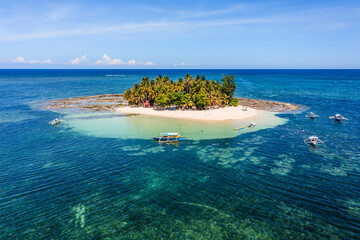 Aerial view of tropical island, ocean and reef, Guyam island, Siargao, Philippines