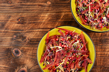 Healthy green salad with sprouts.