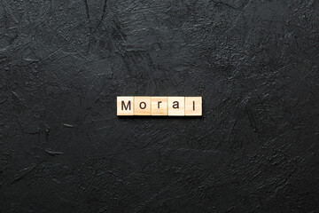 moral word written on wood block. moral text on table, concept