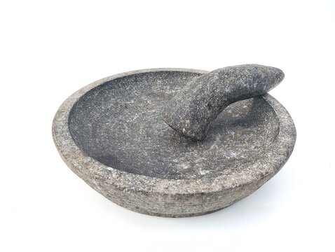 Lumpang batu or Traditional tools for pounding kitchen spices. Isolated on white background 