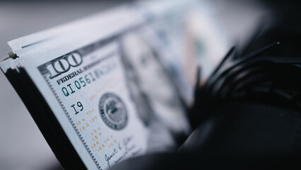 Money counting machine bank machine close up. Macro view counter counting machine counting 100 American dollar bills. Concept of money. Business finance. Cash money.