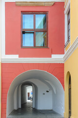 Fototapeta premium Old building facade with white tunnel in Sibiu, Romania