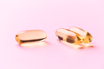 Fish oil capsules with omega 3 on bright background. Concept for a healthy dietary supplementation....