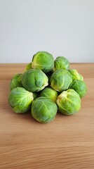 Fresh green brussels sprouts on a rustic wooden background