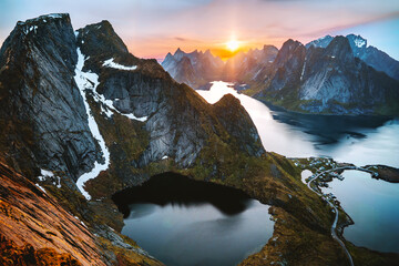 Lofoten islands in Norway mountains and fjord aerial view Reinebringen mountain sunset landscape travel picturesque scenery, Scandinavian nature midnight sun summer season 