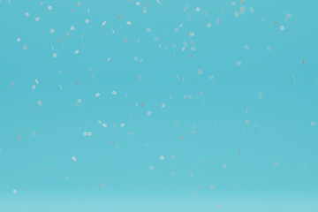 Snowflakes falling down on blue background.