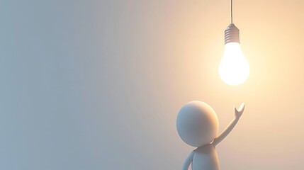 A man is holding a light bulb in his hand, with the bulb shining brightly