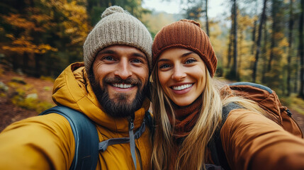 Fototapeta premium Couple Taking Selfie While Hiking in Autumn Forest, Celebrating Togetherness in Nature and Wanderlust, Romantic Adventure, Fall Colors, Outdoor Love, Happy Moments