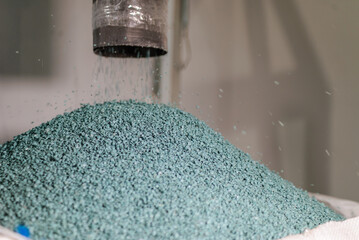 Modern production. plastic processing and production. Round plastic granules move along the prod