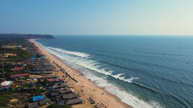 Aerial drone shot of baga beach in goa, empty and clean baga beach in goa 
