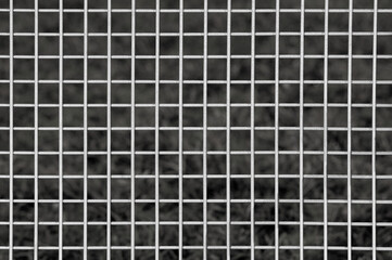 metal grille on grey background close up
