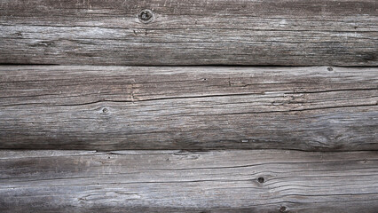 The photo shows old logs in close-up