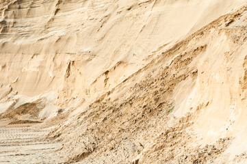 Excavator wheel marks in a sand quarry