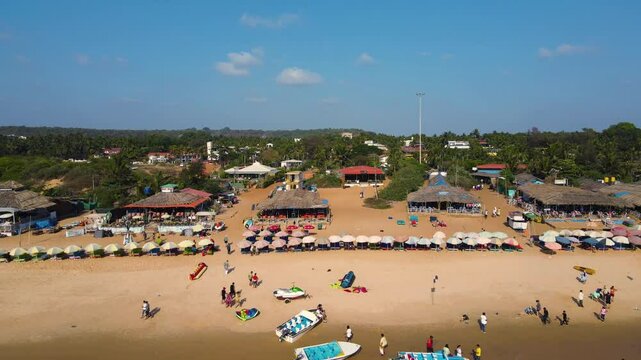 Aerial drone shot of a crowded beach of goa, baga beach. 