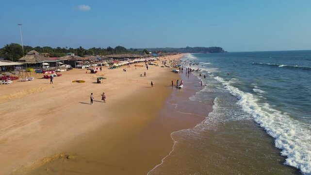 Aerial drone shot of shacks in baga beach in goa. 
