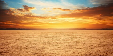 Obraz premium A vast landscape with a flat terrain under a dramatic sunset sky filled with clouds and vibrant colors. Concept Sunset Photography, Vast Landscapes, Dramatic Skies, Cloud Patterns, Vibrant Colors