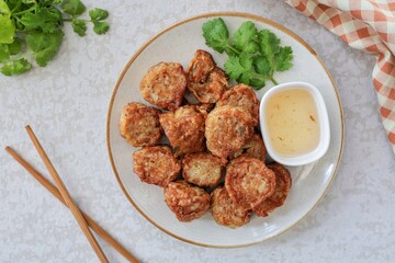 Deep Fried Crab Meat Rolls in ceramic plate , thai called Hoi Jo, top view food