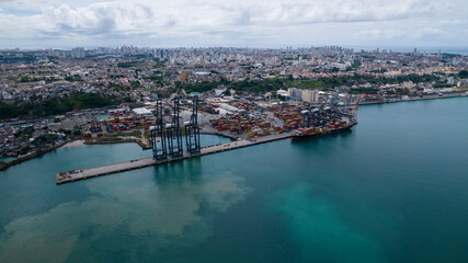 Fototapeta premium Industrial international harbor with container cranes and ship docked
