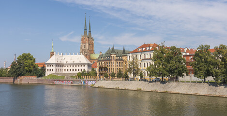 Fototapeta premium Spires Rising Above Calm Waters in Cathedral Island, Wroklaw, Poland
