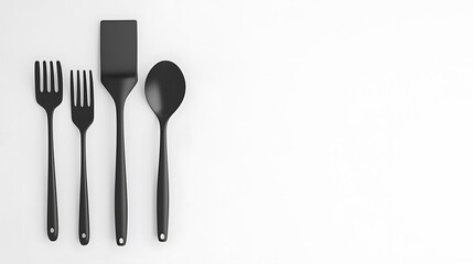 Fototapeta premium A black set of utensils including a fork, spoon, and spatula