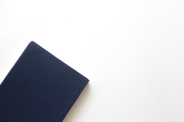 Blue closed notebook. Isolated on white background.