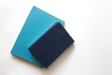 Blue closed notebook. Isolated on white background.