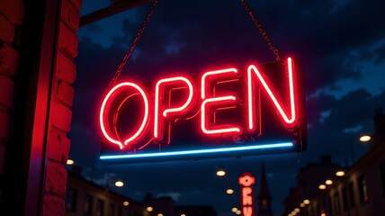 Open neon sign for retail business glowing brightly against the night sky.