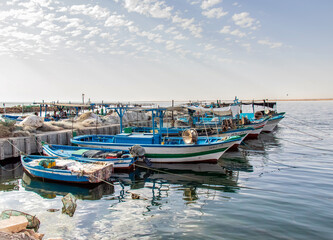 Obraz premium A Fishing Port with Small Fishing Boats in Southern Medenine, Tunisia