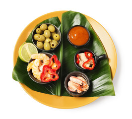 Cut banana leaf with different food and sauce isolated on white, top view. Healthy eco serving