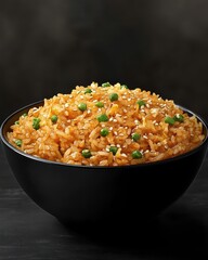 A vibrant bowl of fried rice topped with green peas and sesame seeds, perfect for a delicious meal.