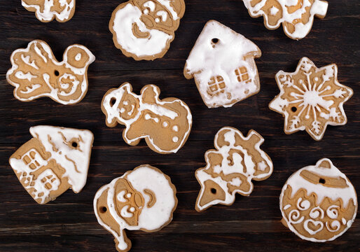 Christmas gingerbread cookies with white icing on a wooden table. holiday cookies. top view