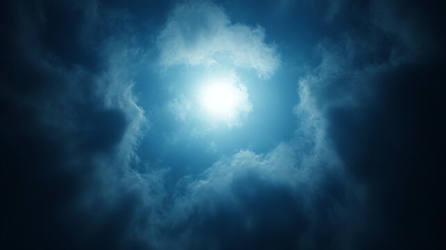 Bright moon shining through dark clouds at night.