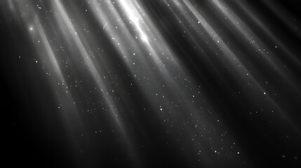 Diagonal light rays with sparkles on black background.