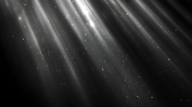 Diagonal light rays with sparkles on black background.