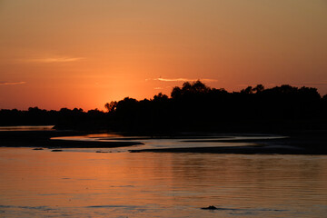 Sunrise over the Luangwa River in Zambia bordering South Luangwa National Park