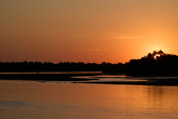 Fototapeta premium Sunrise over the Luangwa River in Zambia bordering South Luangwa National Park