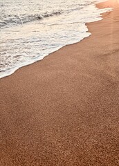 Sunset Beach with Footprints in the Sand.