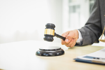 Male lawyer diligently examines documents placed on his desk, demonstrating his professionalism and dedication to finding legal truth, analyzing ideas, and pursuing justice with relentless focus.