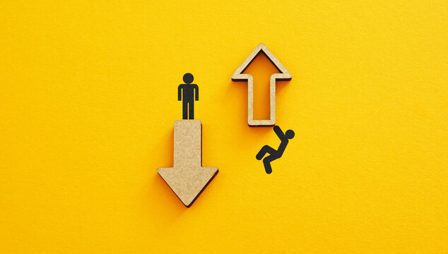 Two arrows moving in different ways, one arrow pointing up and other arrow pointing down, symbolize opposite trends, choices and career development. Growth, decline, increase, decrease concepts
