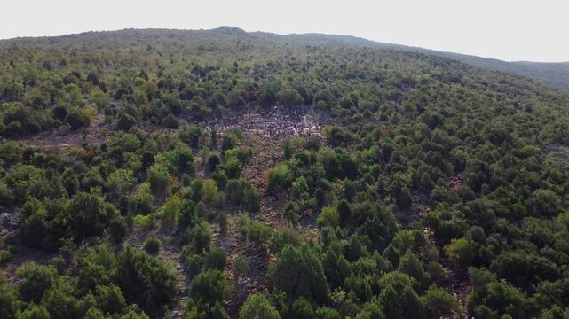 Aerial view of Mount Podbrdo and people on pilgrimage to the statue of Our Lady where the apparitions took place in Medjugorje.