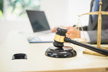 Male lawyer diligently examines documents placed on his desk, demonstrating his professionalism and dedication to finding legal truth, analyzing ideas, and pursuing justice with relentless focus.
