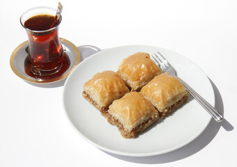 Delicious Baklava with Walnuts and Glass of Black Turkish Tea