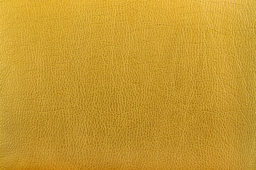 Fototapeta premium abstract background from the painted texture of skin and leather fabric yellow color. close up