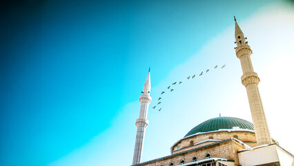 Ramadan or Islamic background for Elegant mosque with minarets and birds in Haci Osman Efendi Mosque