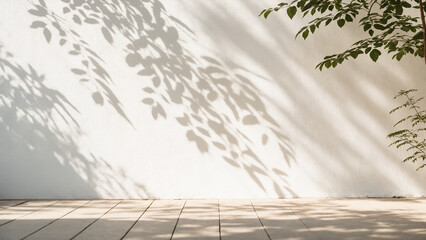 Minimalistic light background with blurred foliage shadow on white wall