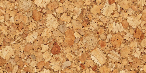 A close-up view reveals the natural texture of cork, featuring unique patterns and warm, earthy colors. The surface showcases a blend of different shades and shapes, highlighting its organic quality